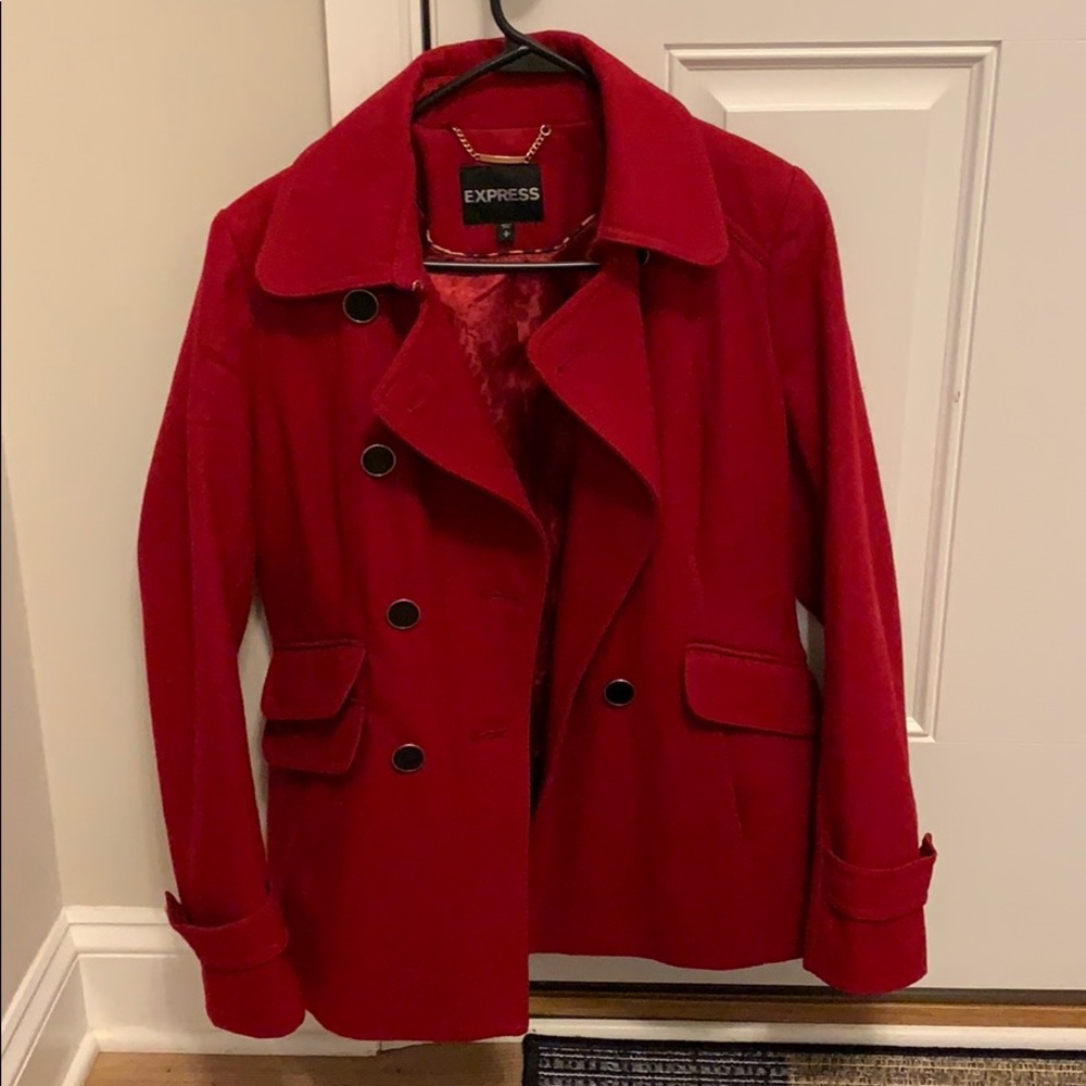 Women’s double-breasted red peacoat.